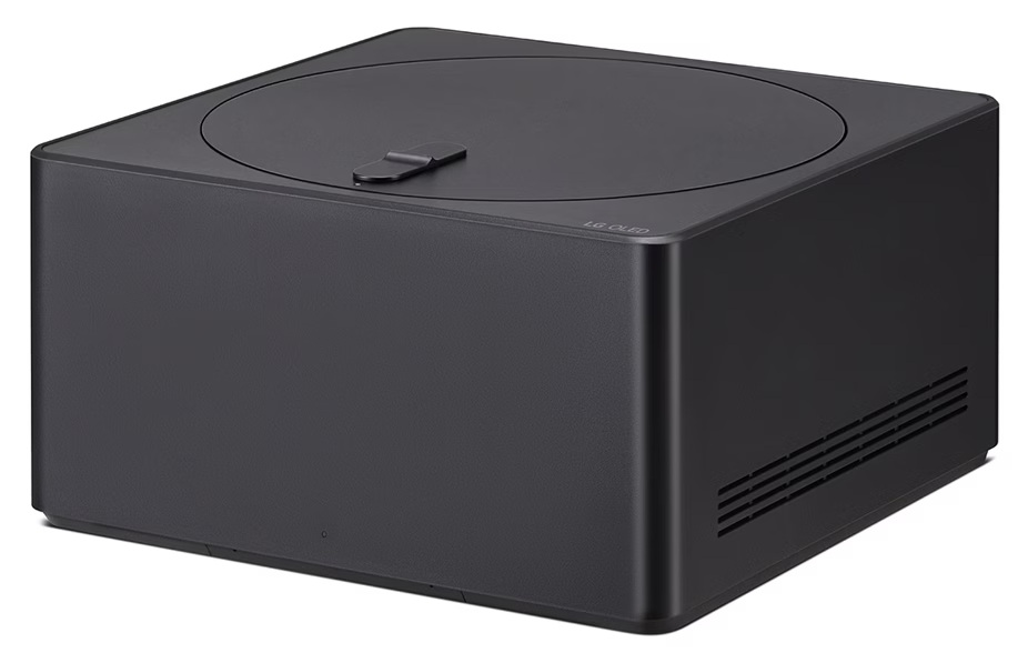 Czarna skrzynka z pokrywą, etykietą LG OLED i otworami wentylacyjnymi.