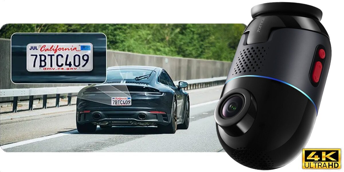 Kamera samochodowa z tablicą rejestracyjną i samochodem na drodze.