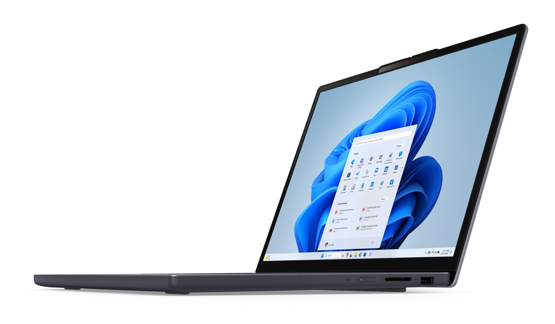 Szary laptop Lenovo, otwarty, interfejs Windows 11 na ekranie. Czarne tło. Widok z boku.