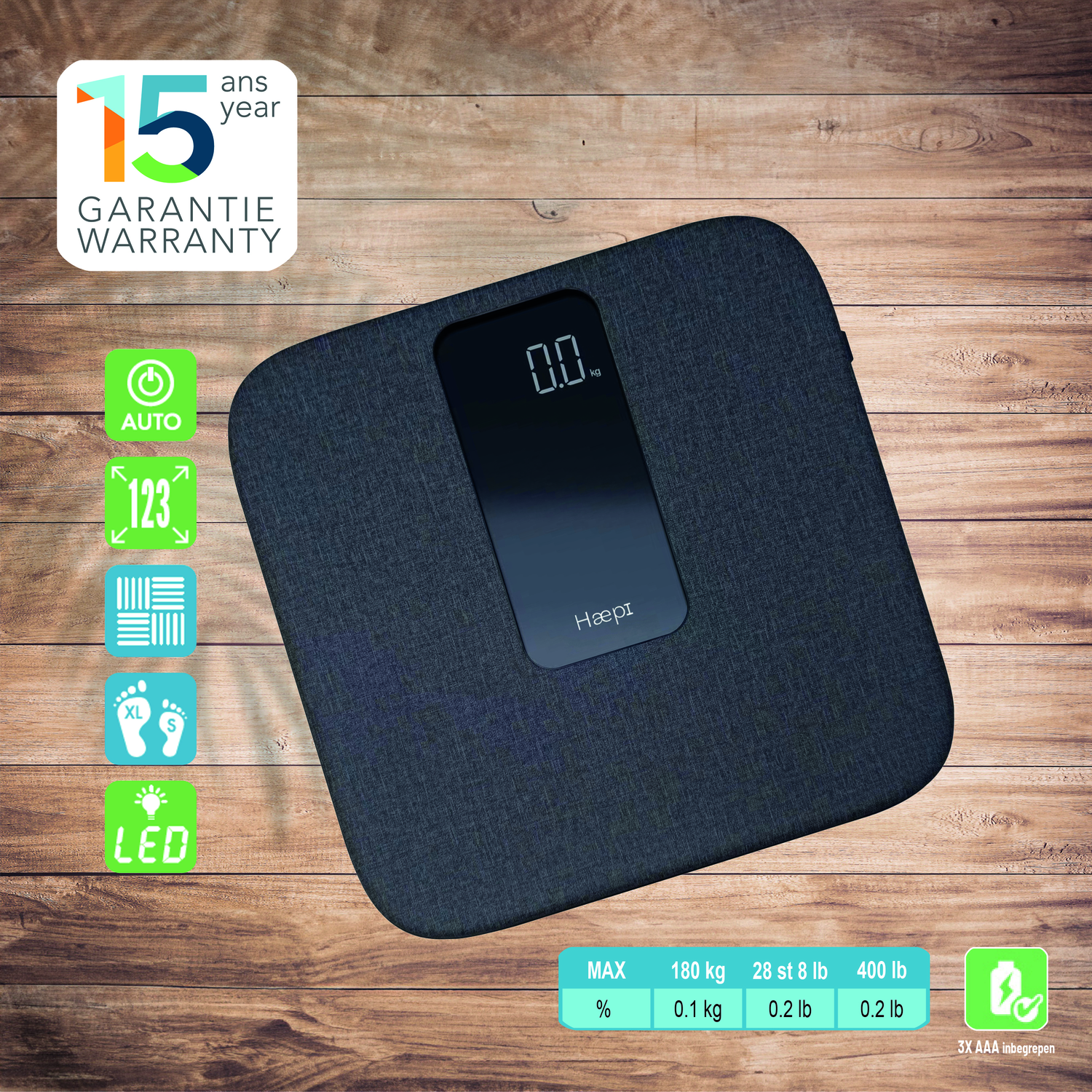 A dark gray scale on a wooden surface, with a digital display showing 0.0 kg. Various icons are visible.