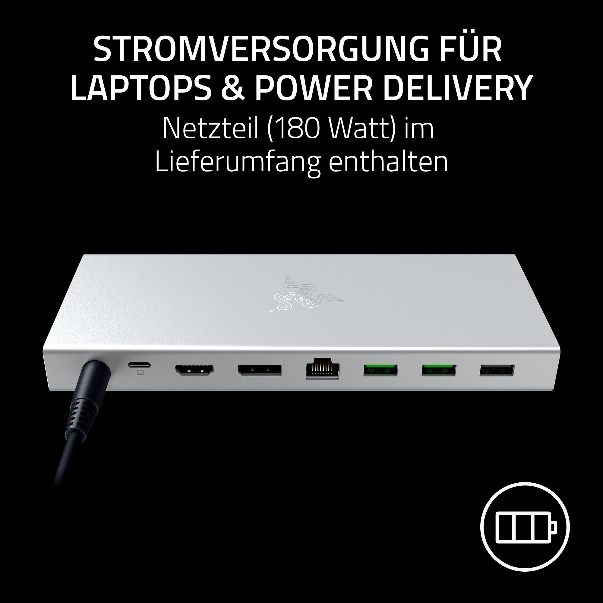 Silberne Razer-Dockingstation mit Netzteil. Die Dockingstation hat mehrere Anschlüsse und ein Netzkabel.