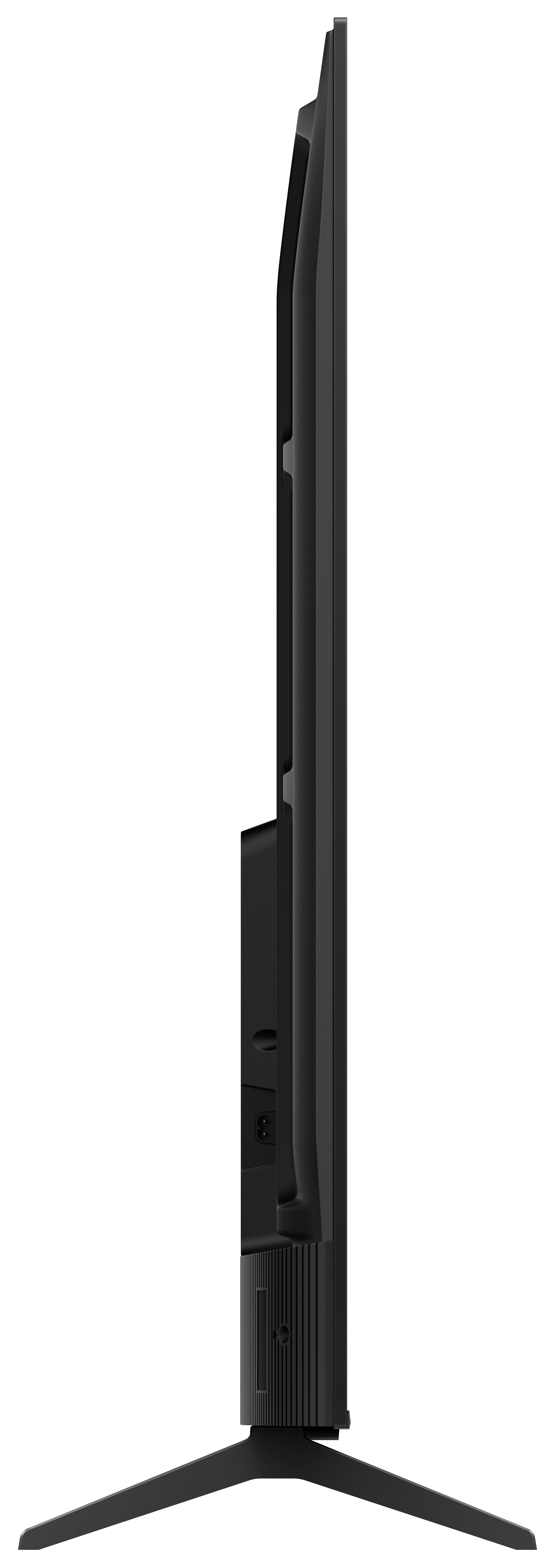 Widok z boku czarnego telewizora na czarnym tle, pokazujący jego smukły profil i podstawę.