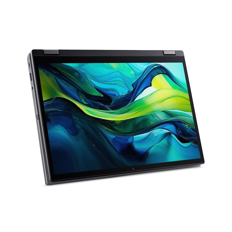 Portátil desde arriba, mostrando teclado y panel táctil. La pantalla muestra colores verdes y azules.