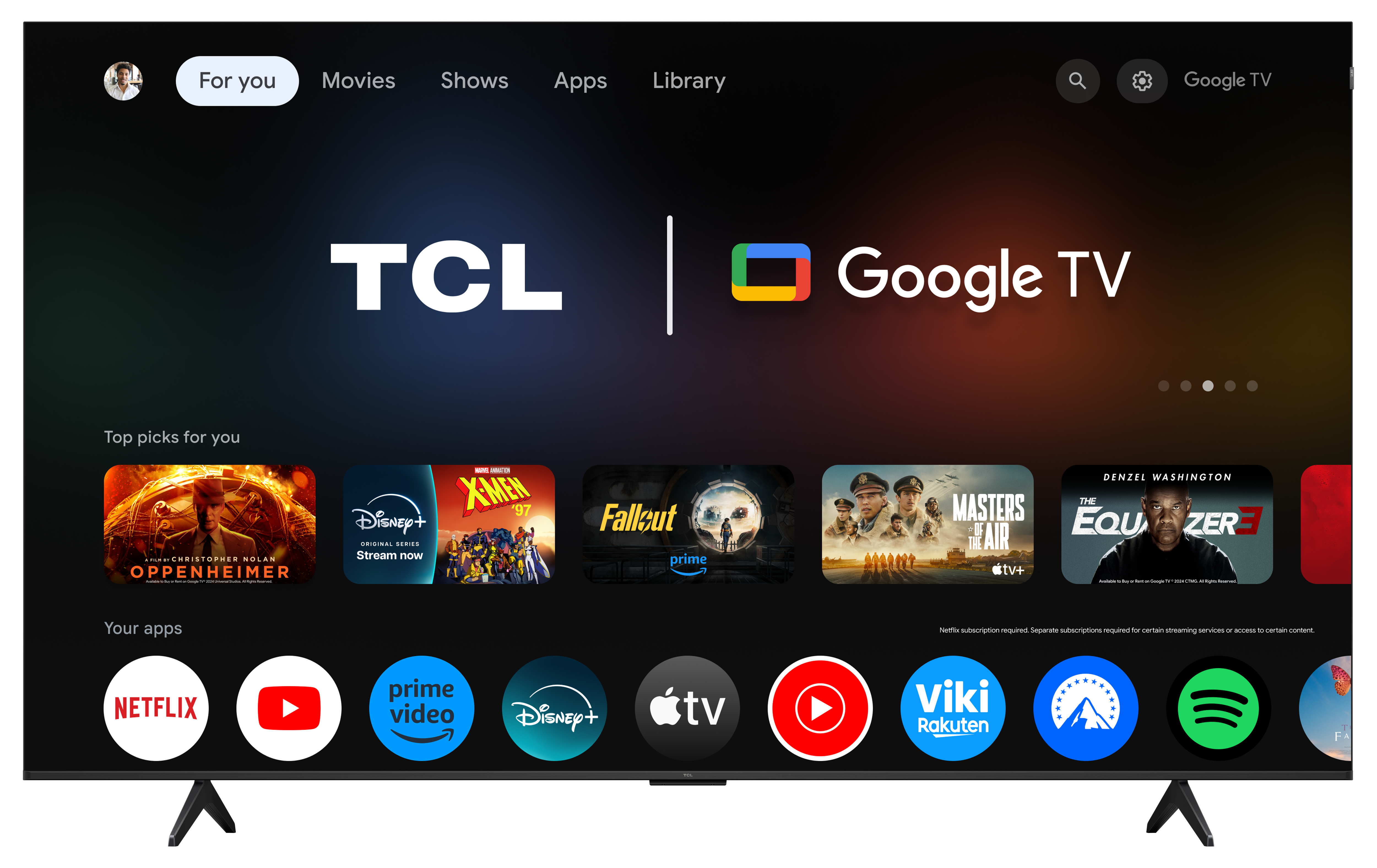 Interfejs TCL Google TV z sugestiami filmów i ikonami aplikacji na czarnym ekranie.