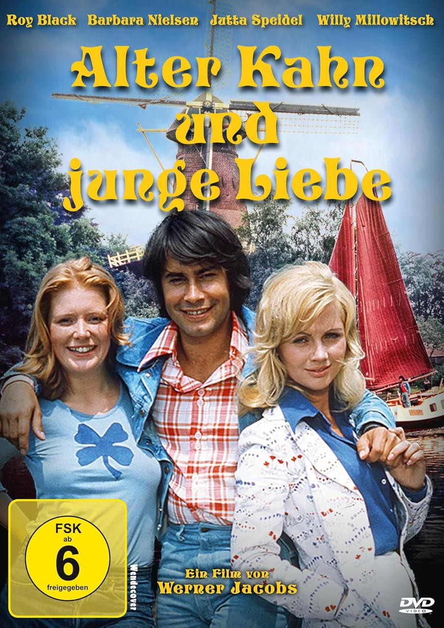 DVD-Cover: 'Alter Kahn und junge Liebe'. Drei Personen in der Nähe einer Windmühle und eines Bootes. Blauer Himmel, FSK-Logo.