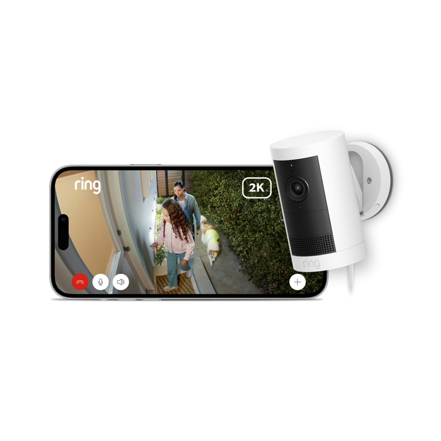 A phone displays a video of a man, girl, and dog walking. A white Ring camera is mounted on a wall.