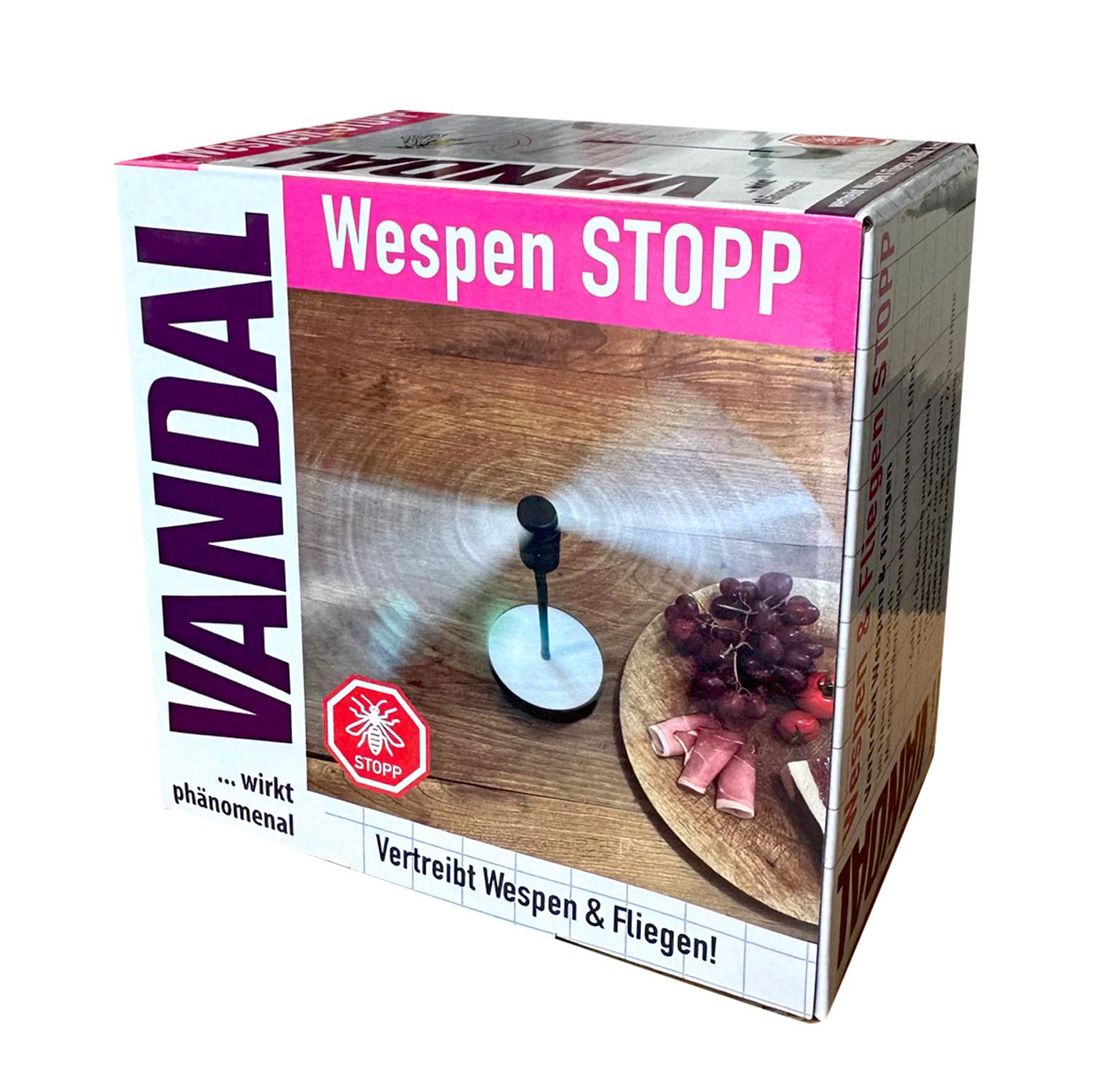 Karton mit einem Bild eines Ventilators und Lebensmitteln. Text in Pink: 'Wespen STOPP'.