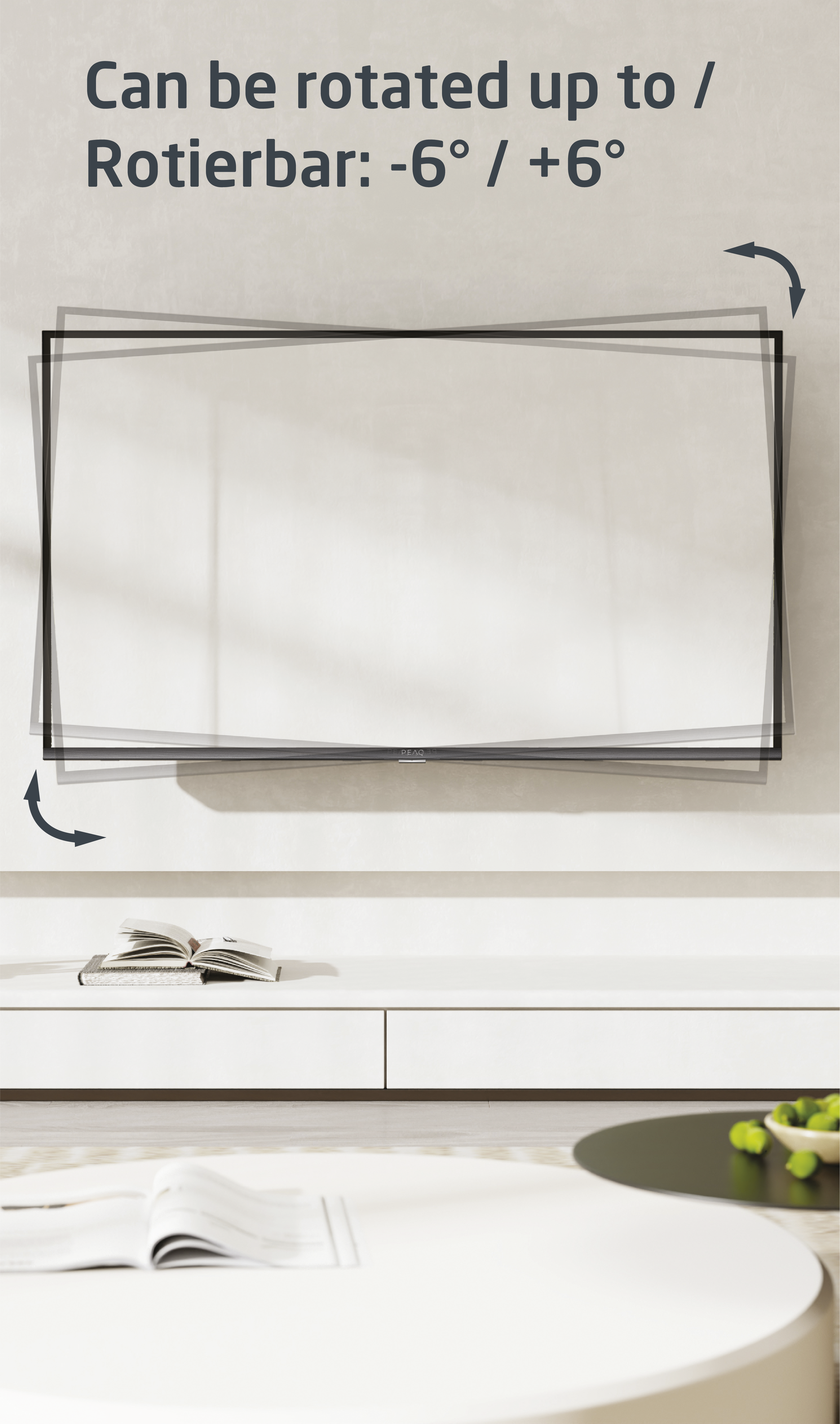 Ekran telewizora zamontowany na ścianie, lekko pochylony. Książka i stół z przodu.