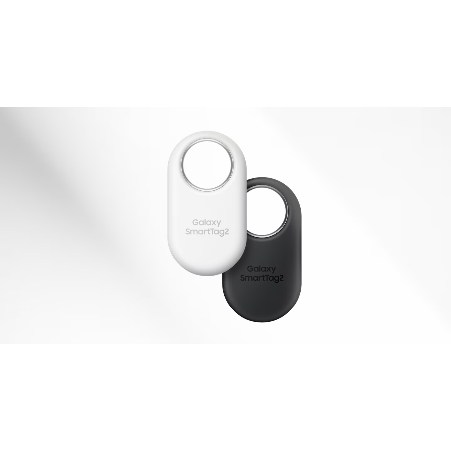 Two Galaxy SmartTag2 trackers, one white, one black.