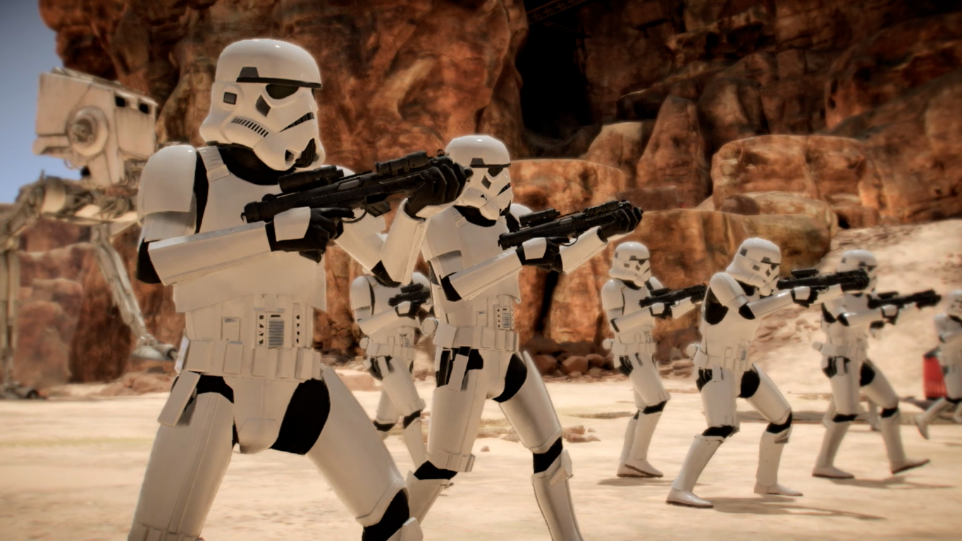 Grupa szturmowców celuje z karabinów, pustynne tło.