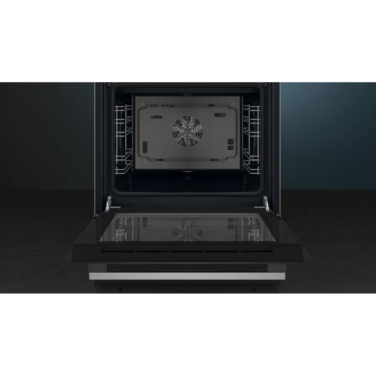 The inside of a black oven, with a fan, a light, and the door is open, showing the interior.