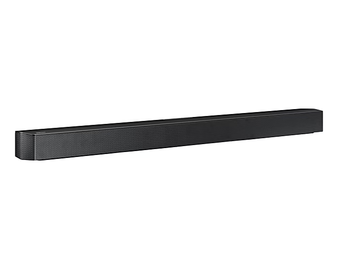 Fekete soundbar fehér háttérrel. Hosszú, téglalap alakú, texturált felülettel.
