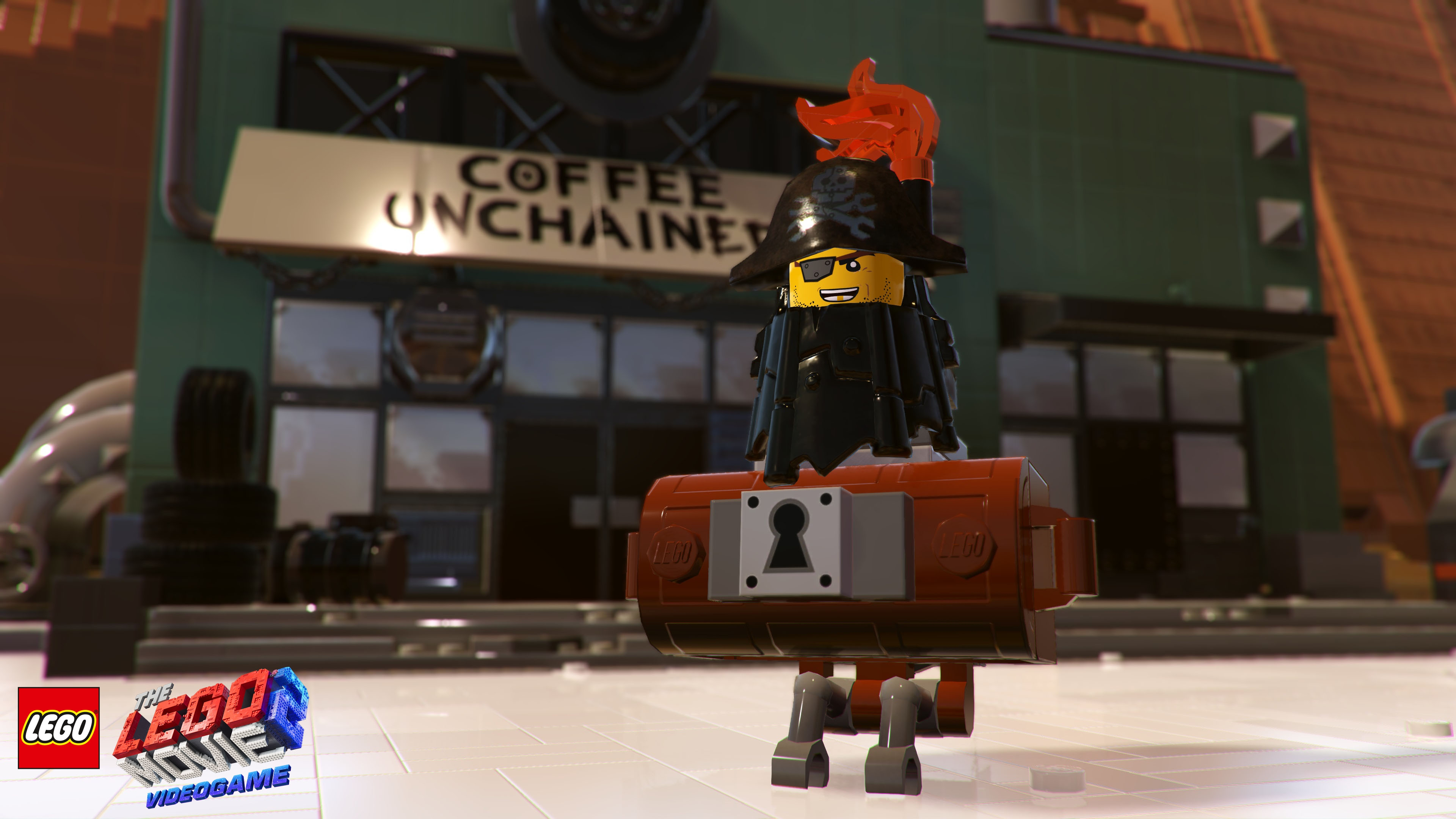 Personaggio Lego davanti a un negozio Coffee Unchained, con un forziere.