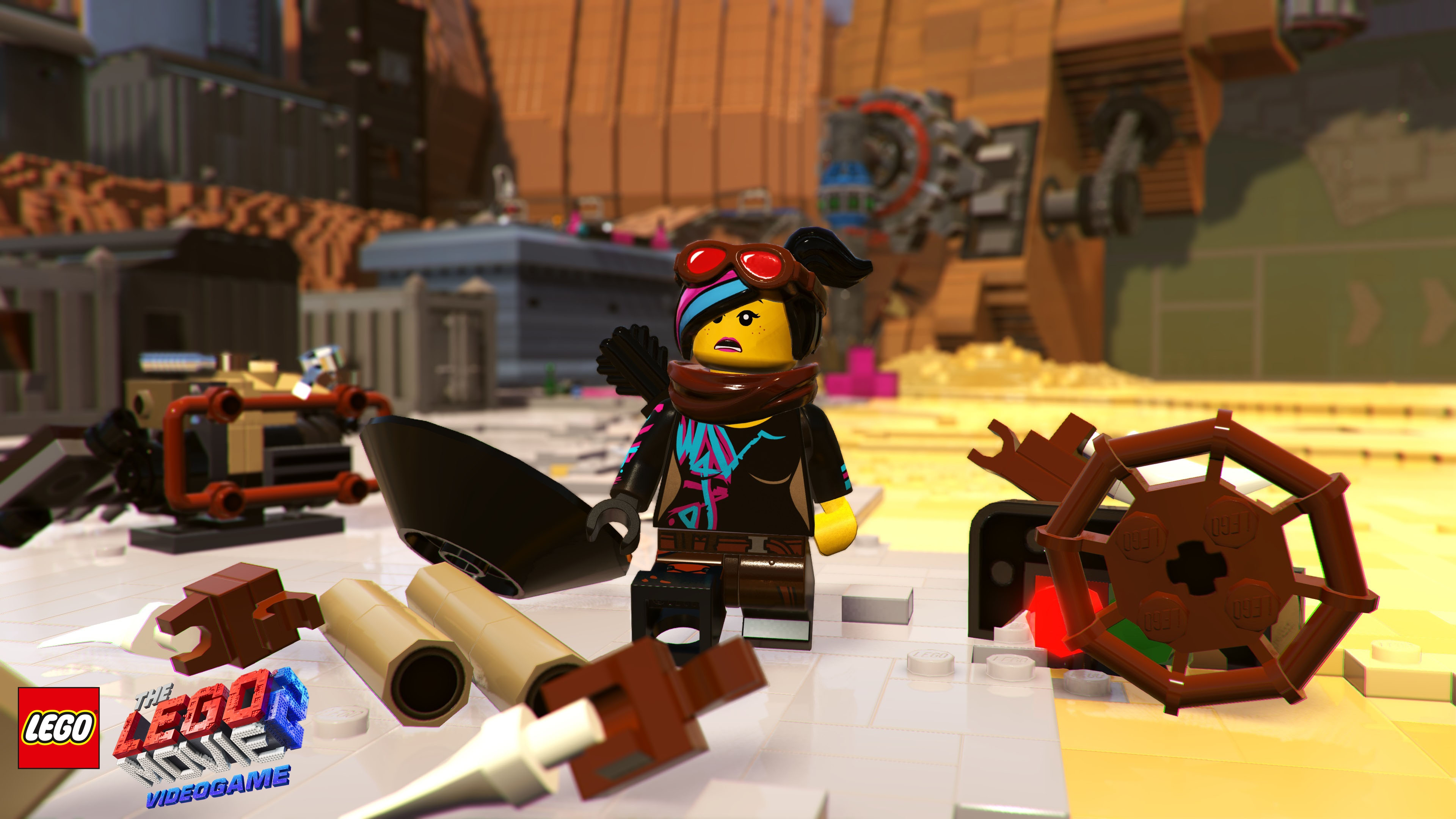 Un personaggio Lego in una scena desertica, circondato da strutture e oggetti Lego.
