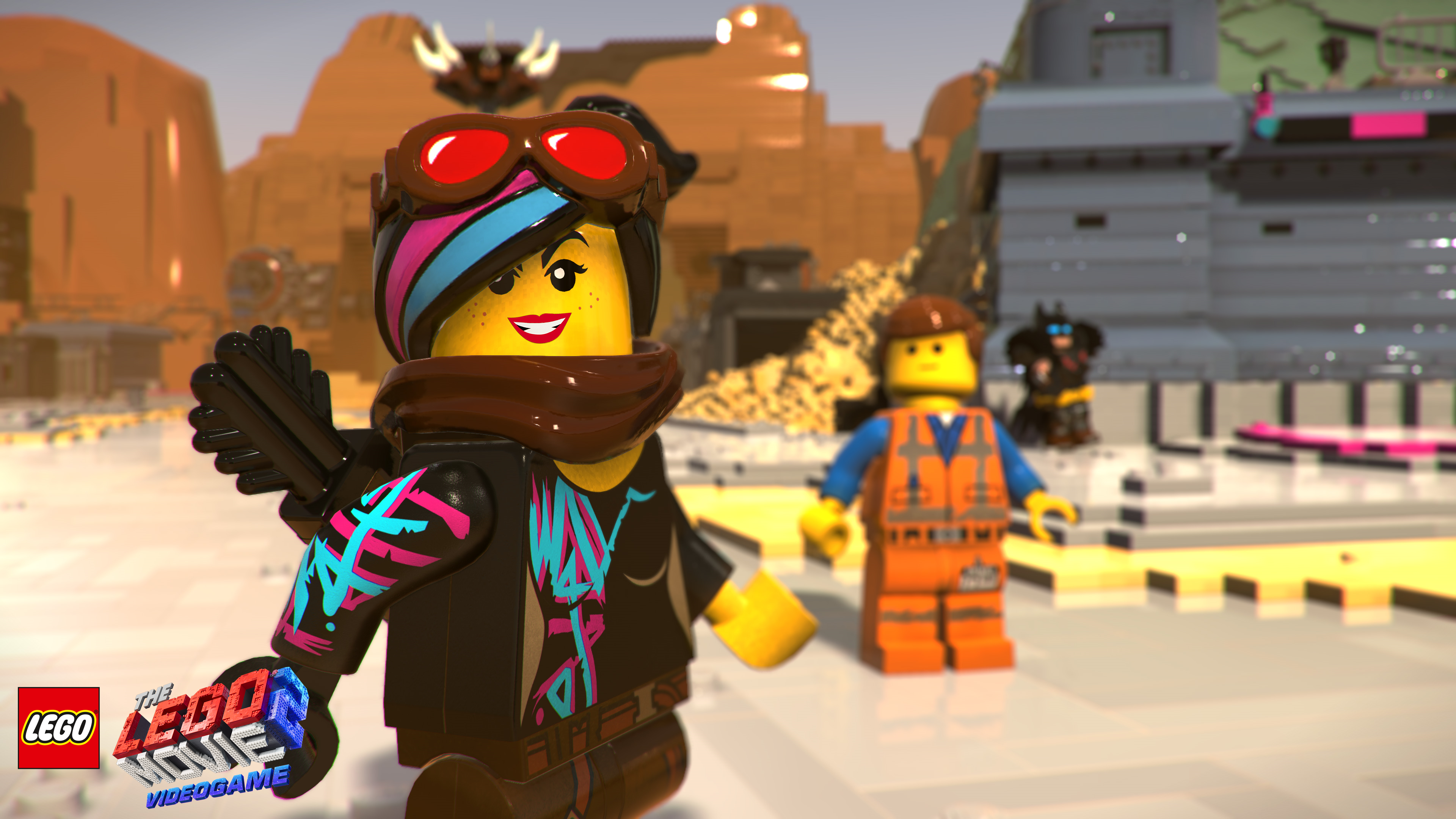 Personaggi Lego in una scena di un videogioco Lego con sfondo desertico.