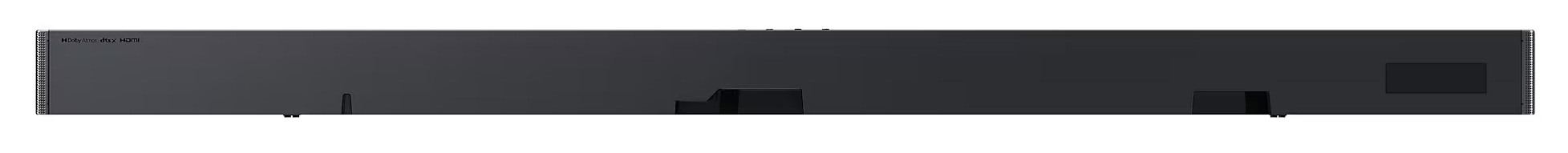 Czarny soundbar, widziany od spodu, z widocznymi różnymi portami i wejściami.