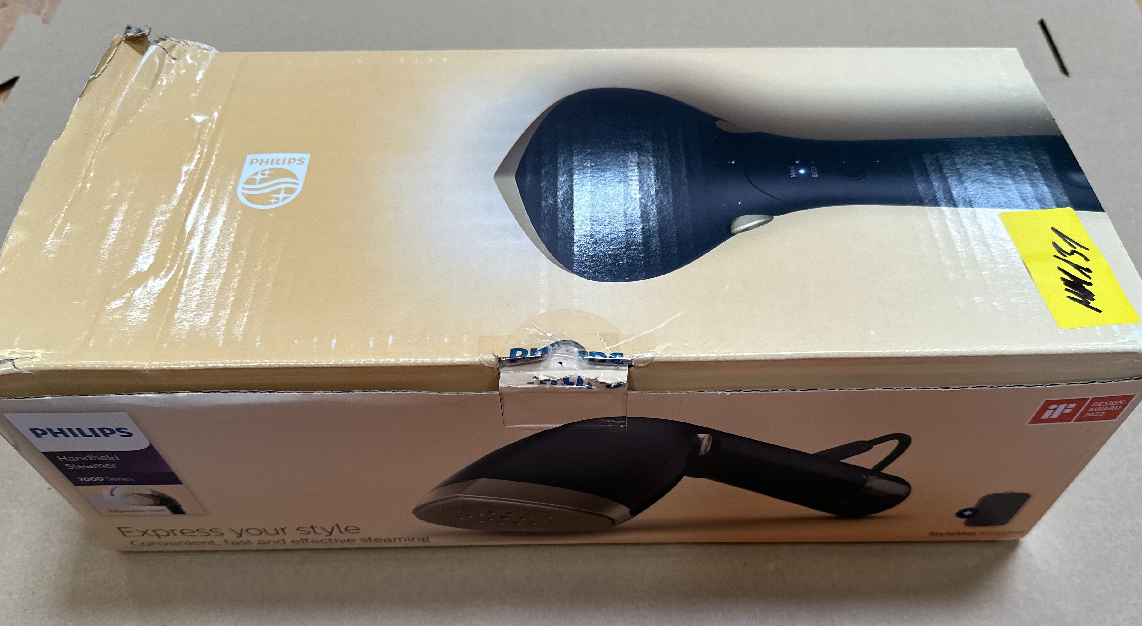 Pudełko parownicy ręcznej Philips, beżowe, czarna parownica.