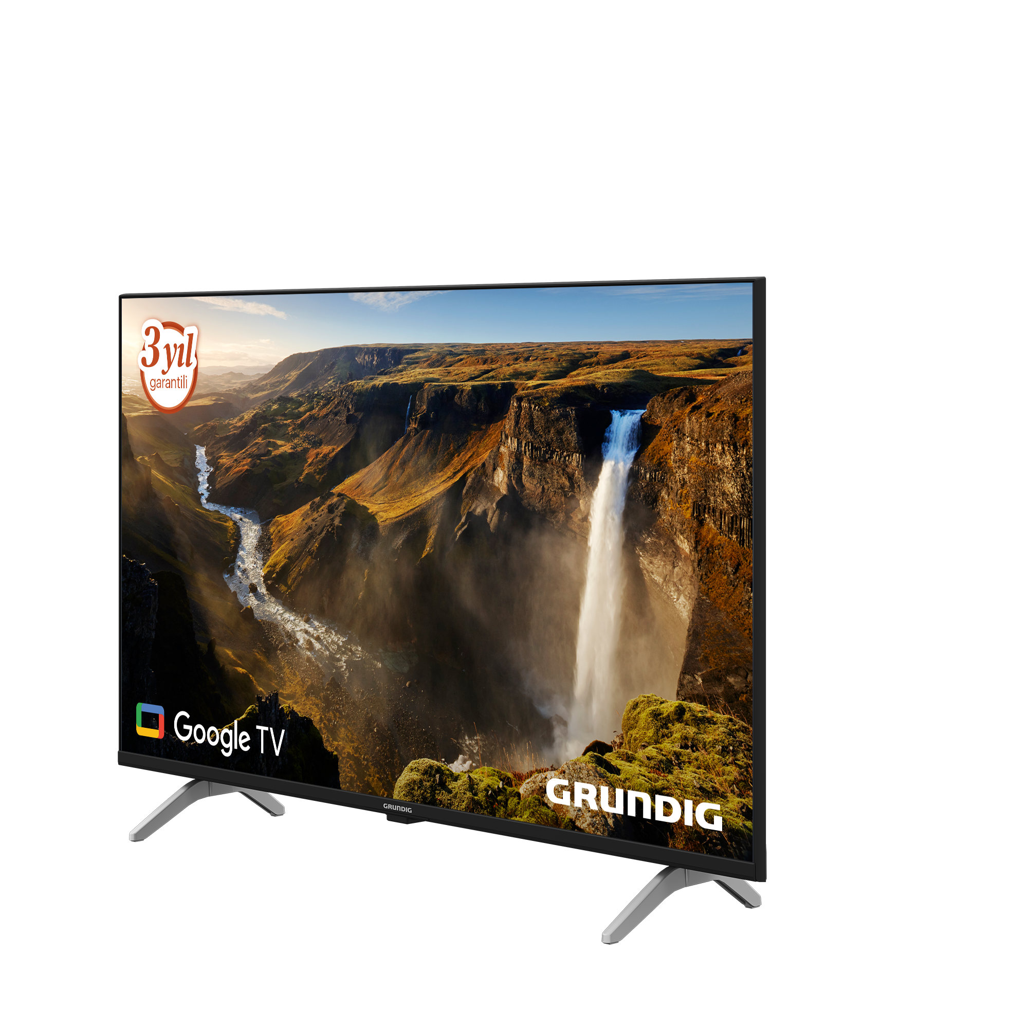 Grundig TV, şelale sahnesi görüntülüyor. Google TV logosu, 3 yıl garanti ve beyaz ayakları var.