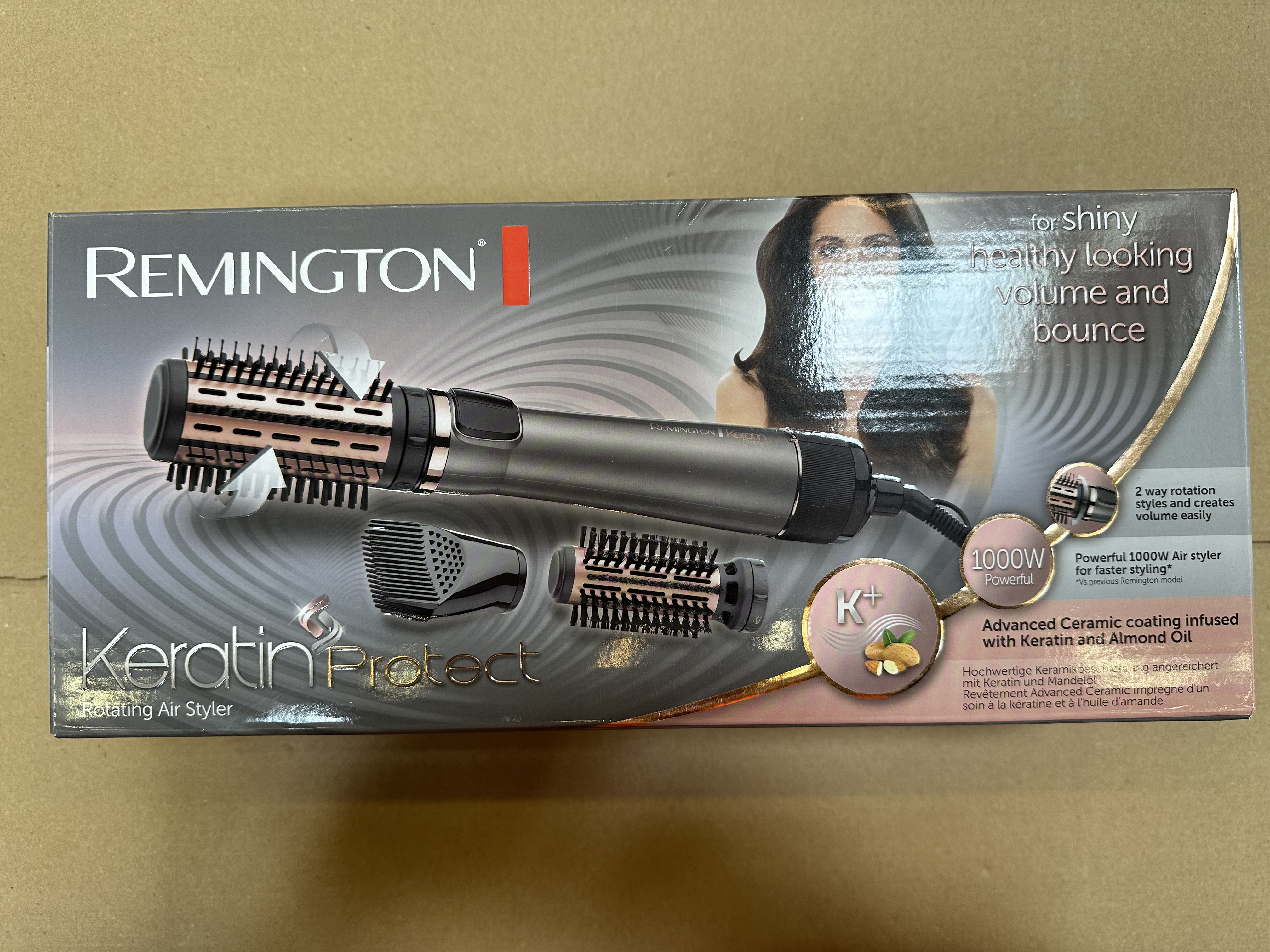 Pudełko do stylizacji włosów Remington. Styler, nasadki i tekst. Złoto i czerń.