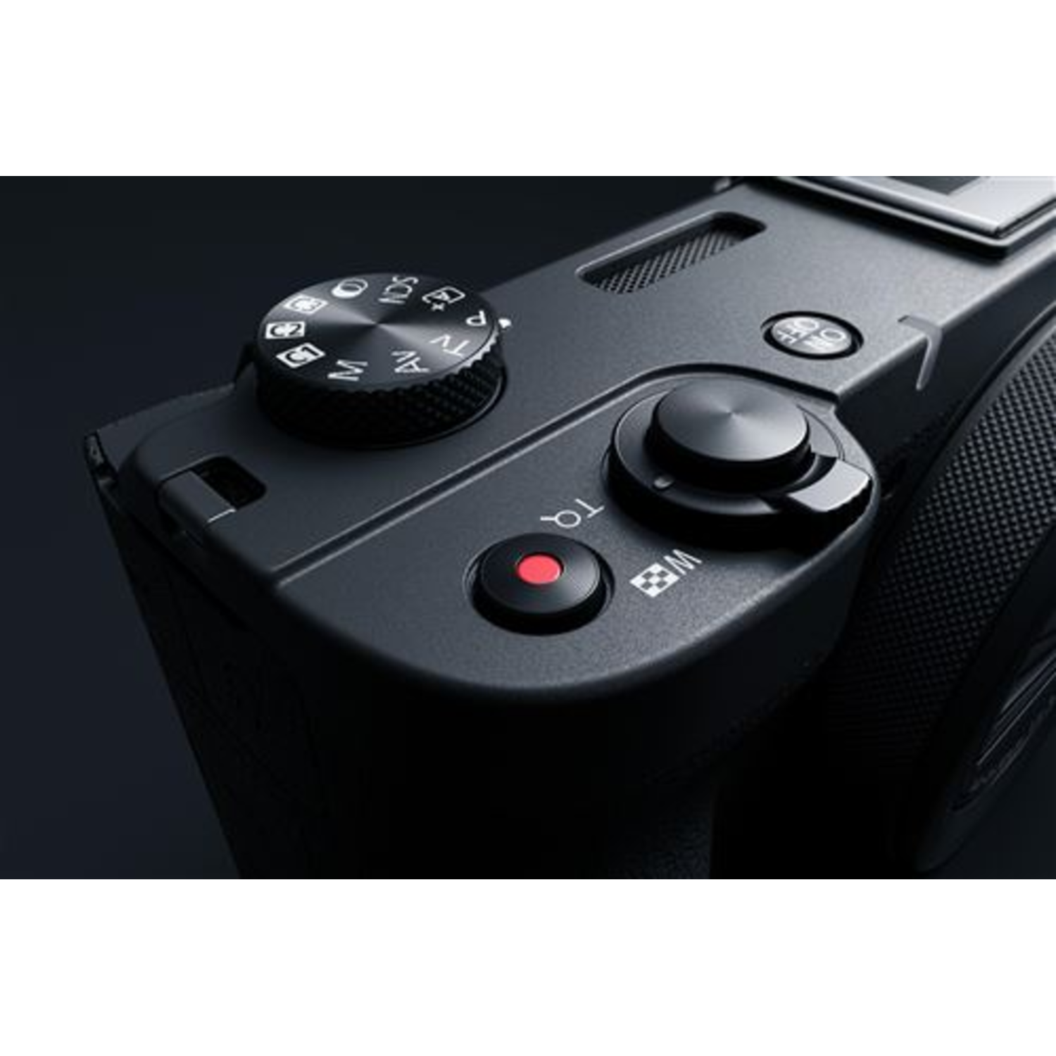 Black camera corner view, showing controls and a record button.