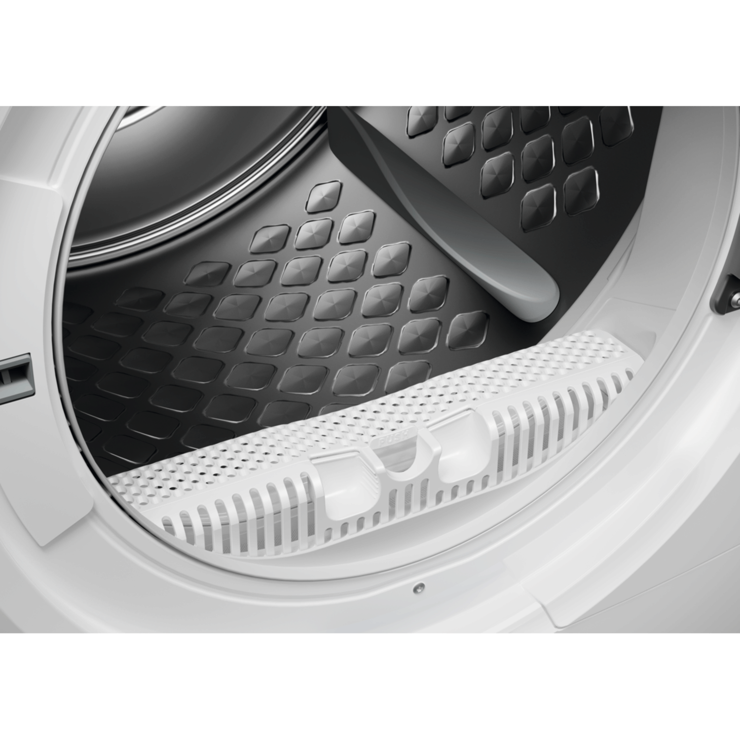 Inside of the dryer. Black drum with diamond pattern. White filter housing at the bottom. Interior view.
