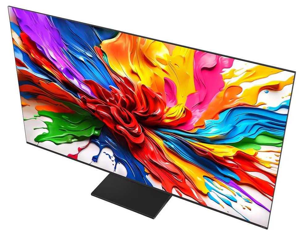 Widok z góry na telewizor LG wyświetlający kolorową sztukę abstrakcyjną na białej powierzchni.