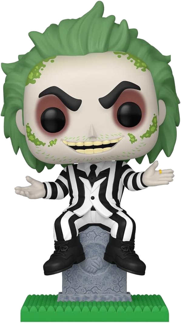 Figura de Beetlejuice sobre una lápida. Tiene pelo verde, un traje a rayas y una expresión traviesa.