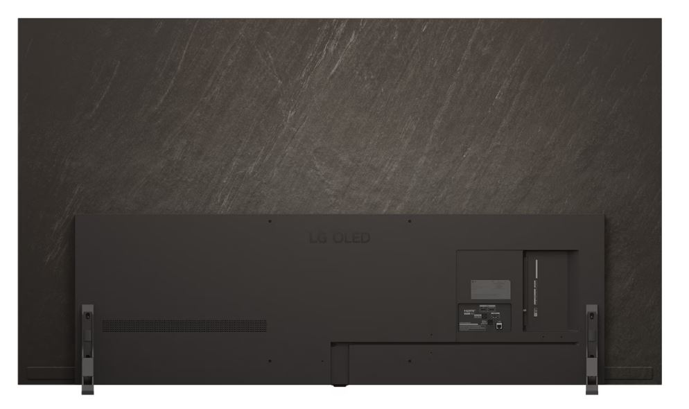 Karanlık, dokulu bir duvarda büyük siyah bir LG OLED TV'nin arkası. Bağlantı noktaları ve stand görünür.