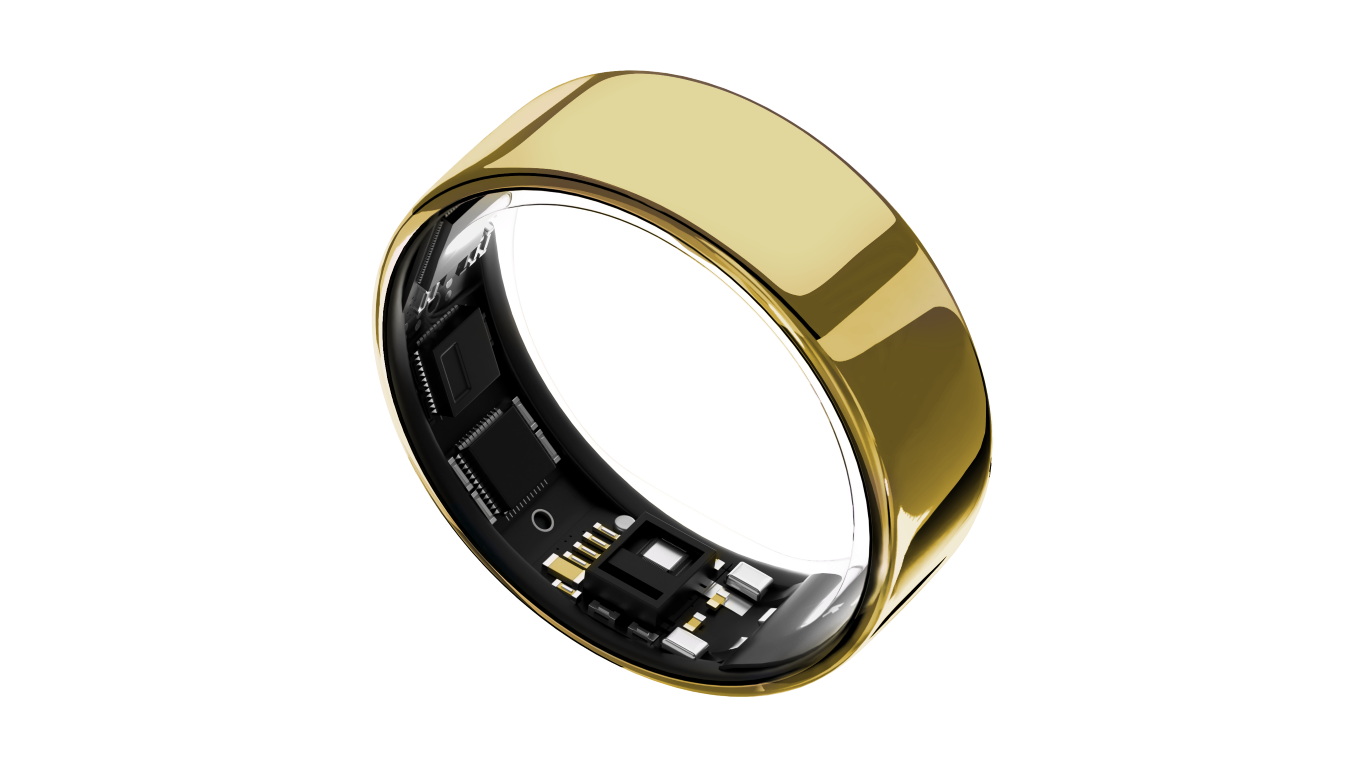 Złoty smart ring z czarnym wnętrzem, pokazujący płytkę obwodu. Czarne tło.