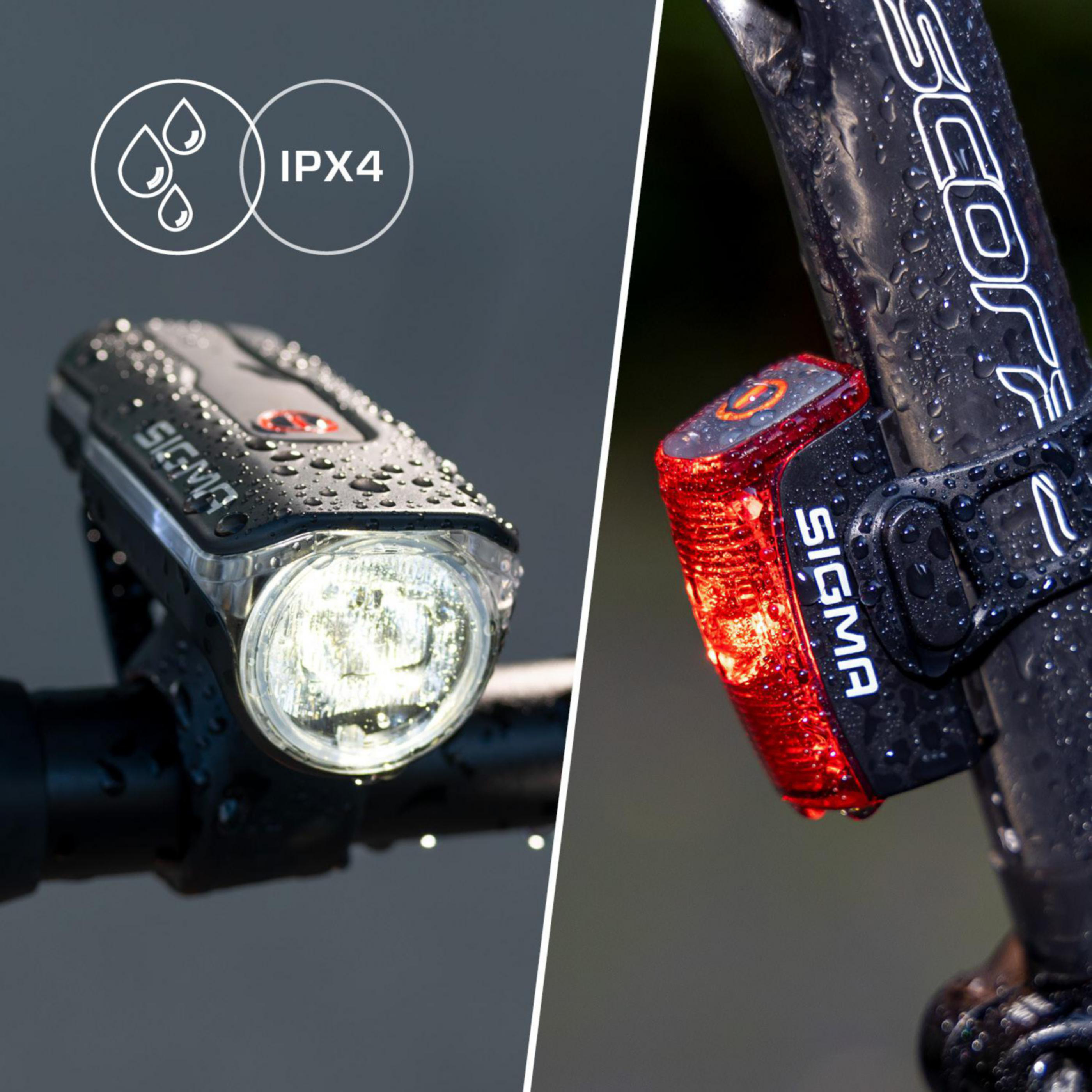 Schwarze Fahrradlichter mit Wassertropfen, IPX4. Vorne weiß, hinten rot.