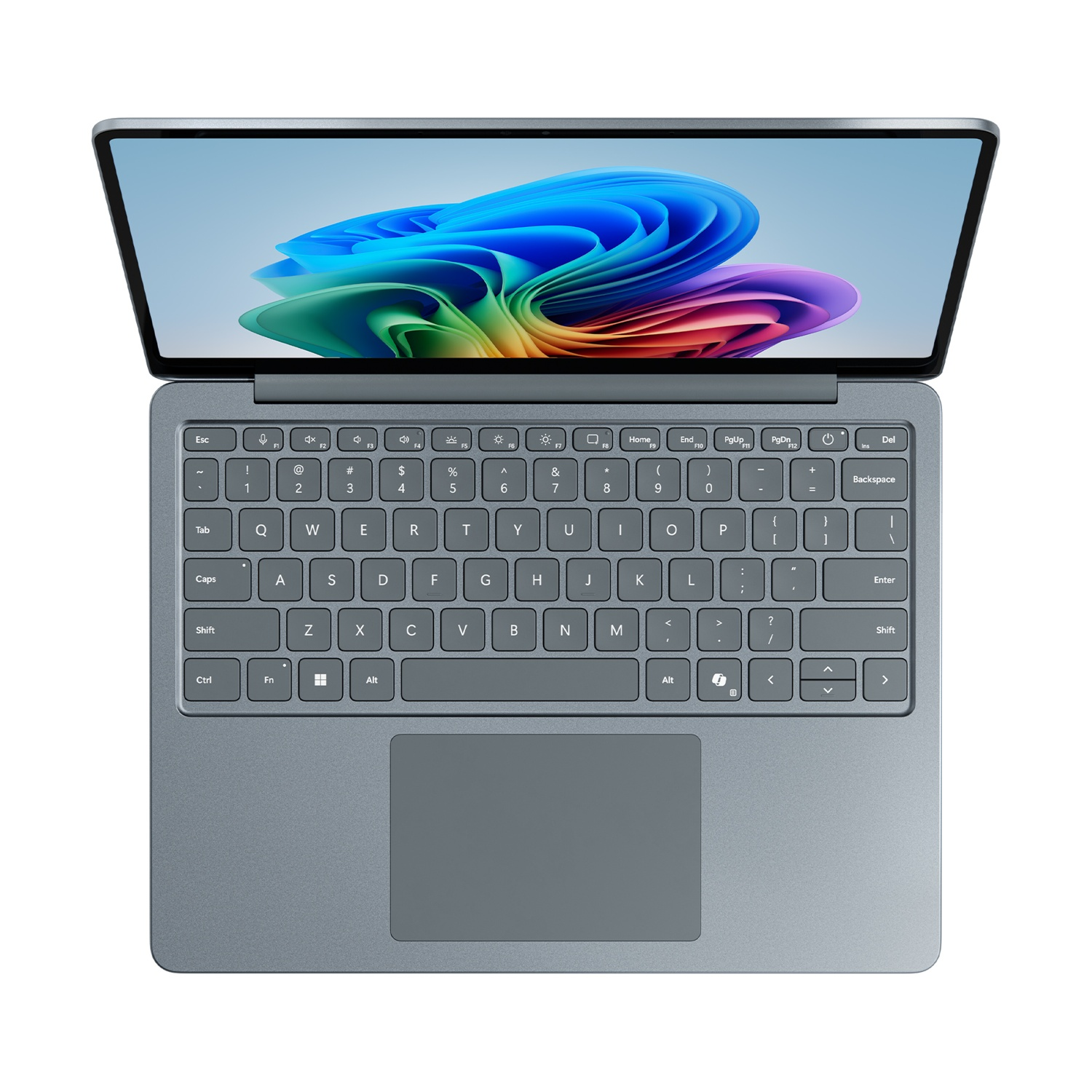 Un laptop grigio, aperto, che mostra uno schermo colorato e una tastiera.
