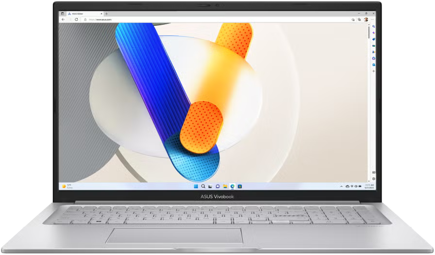 Ezüst laptop, nyitva, kék, narancs és fehér absztrakt háttérrel a képernyőn.