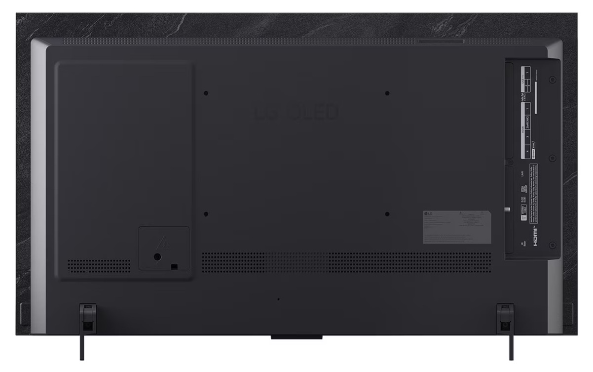 Ekran telewizora wyświetlający kolorowy, abstrakcyjny wzór z różowymi i turkusowymi wirami oraz rokiem 2025.