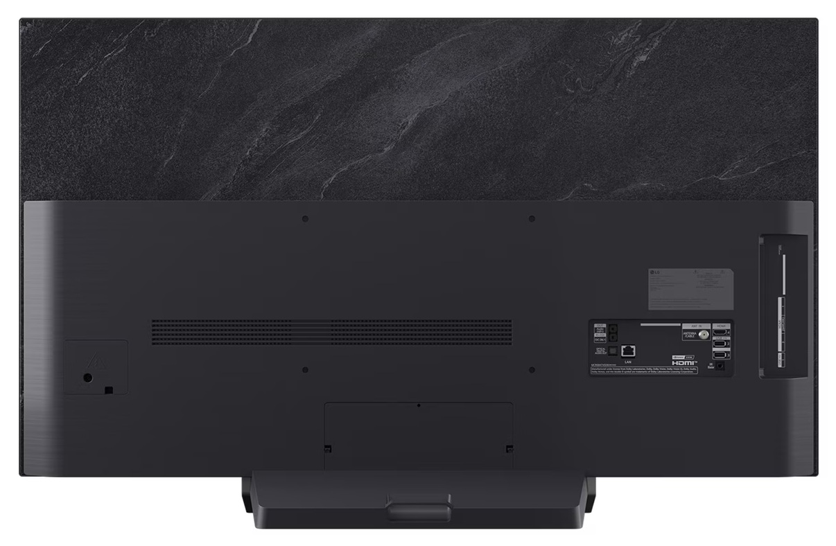 Tył telewizora z portami, kablem i podstawą.