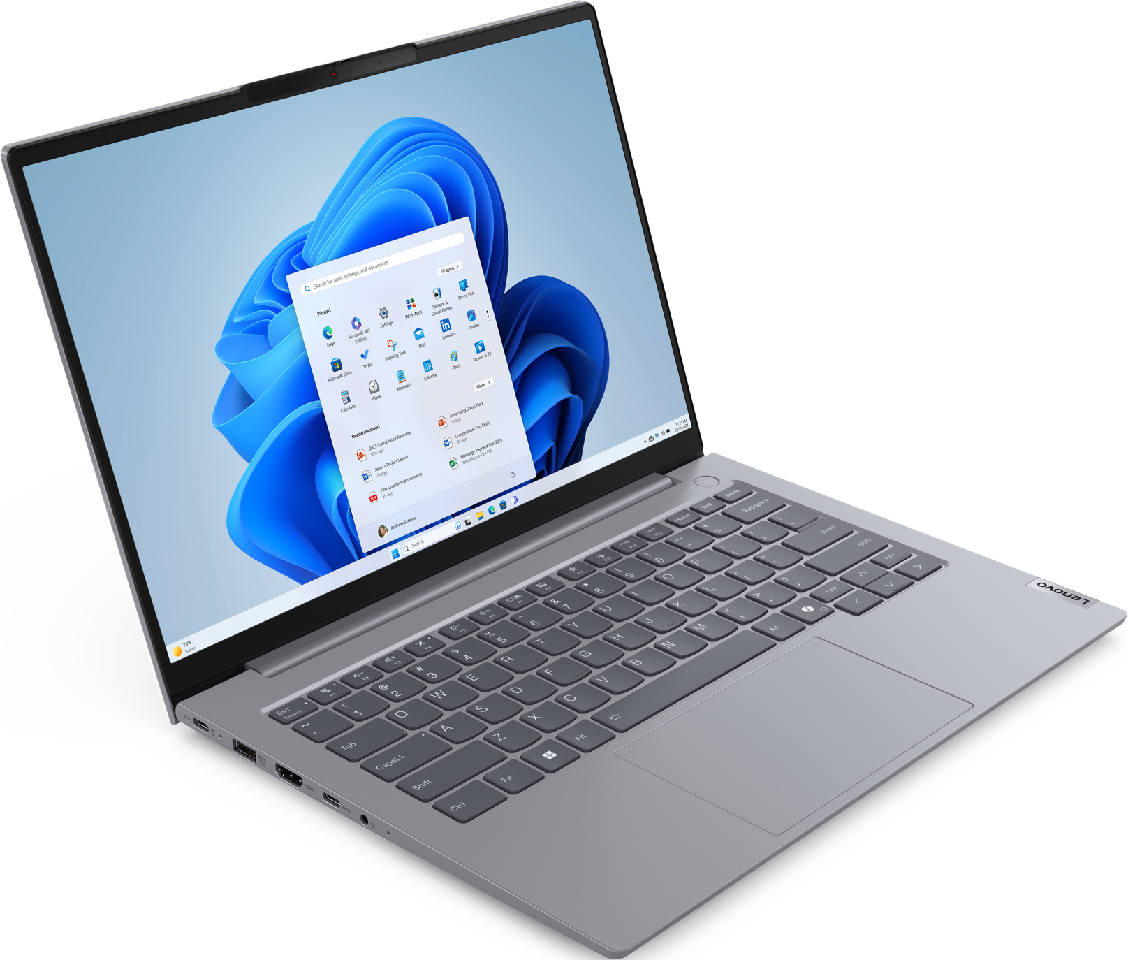 Offener grauer Laptop mit Windows 11 Oberfläche, Apps und Tastatur.