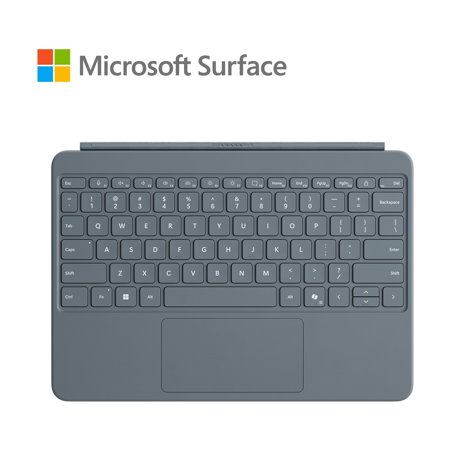 Tastiera grigia con trackpad. Logo Microsoft Surface nell'angolo in alto a sinistra.