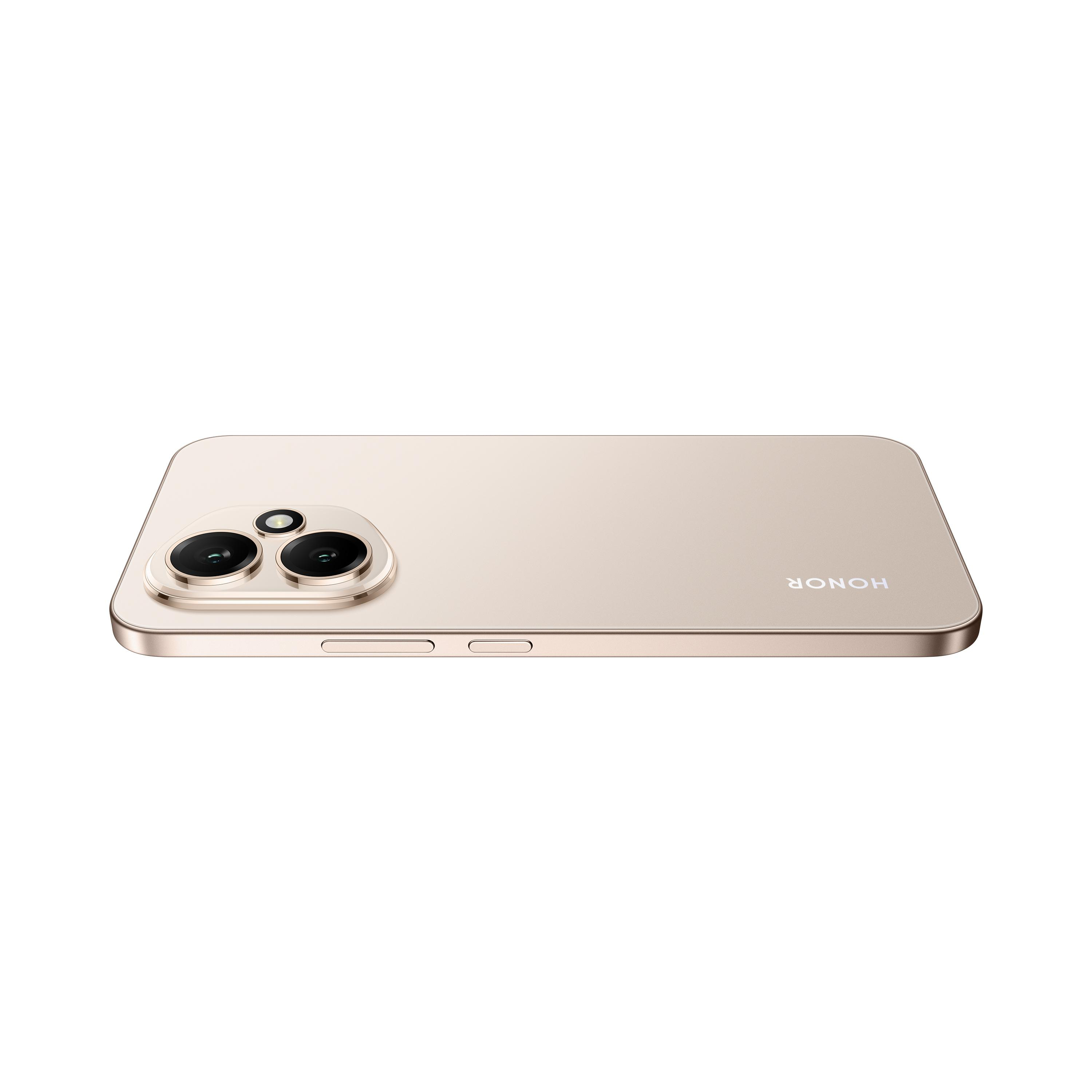 Goldenes Telefon mit Kameras, flach liegend, mit HONOR-Logo.