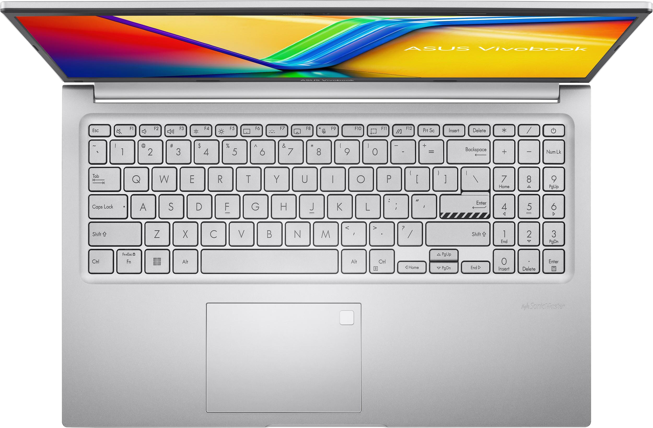 Felülnézet az ezüst Asus Vivobook laptopról billentyűzettel. A touchpad látható. Fekete háttér.