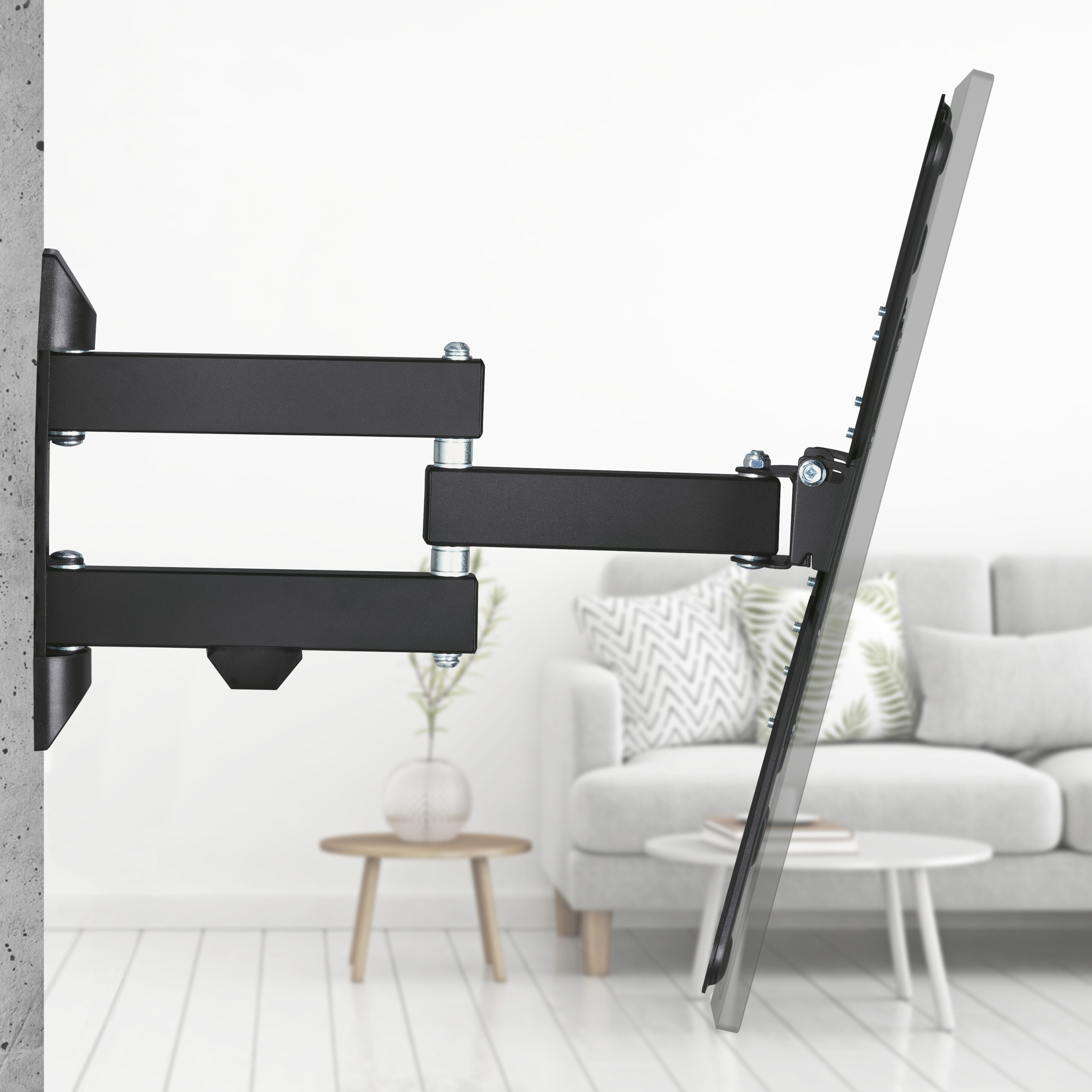 Czarny ekran telewizora zamontowany na czarnym, przegubowym ramieniu na białej ścianie.