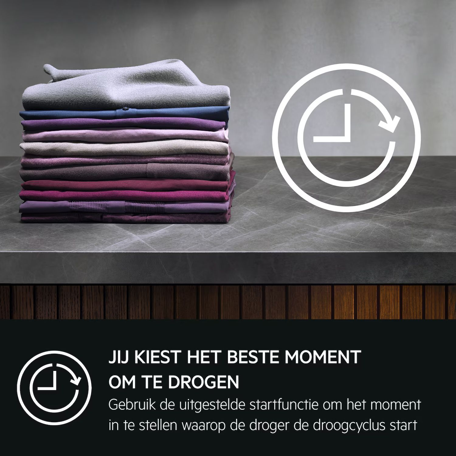 Folded clothes in various colors sit on a counter. A clock icon is on the right.