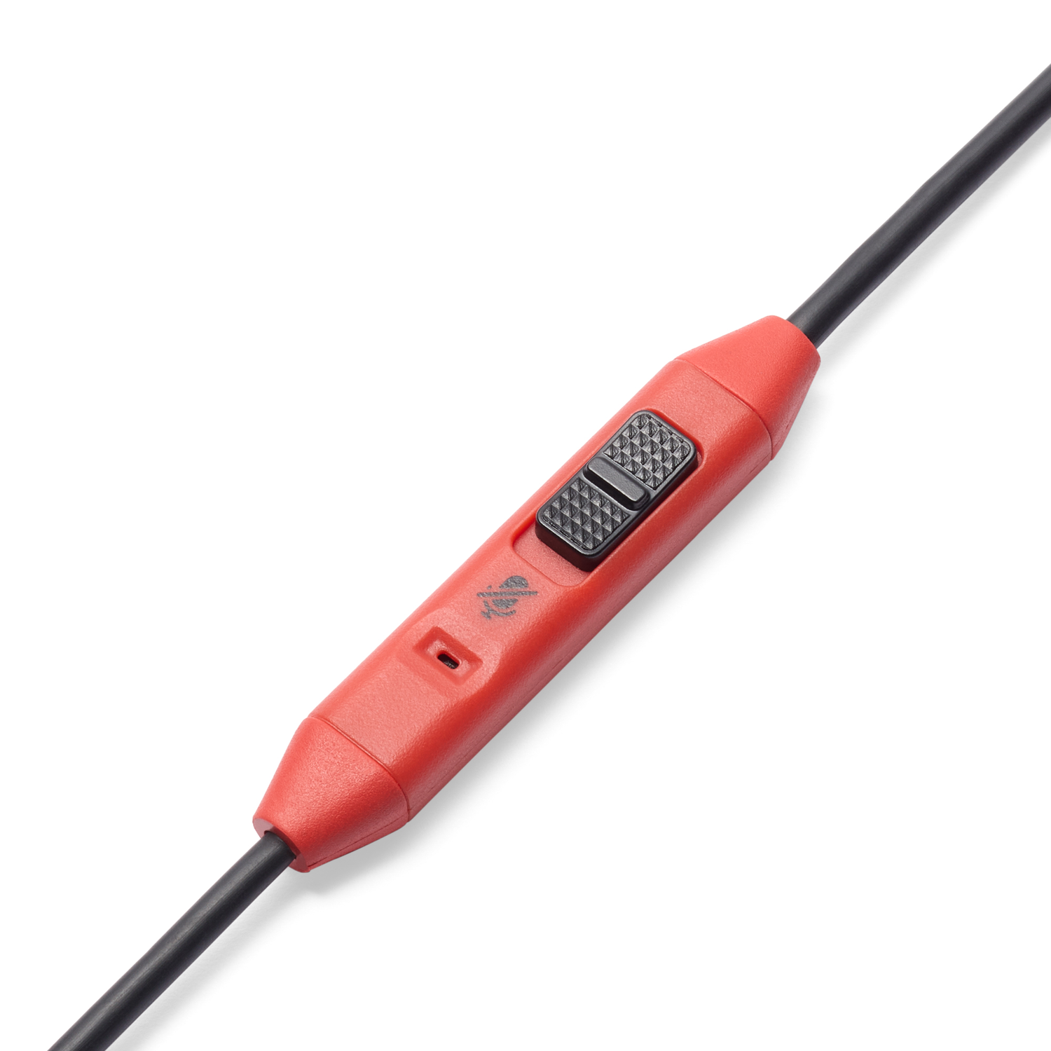 Close-up of a red control box on Mario Kart earbuds cable. It has a switch.