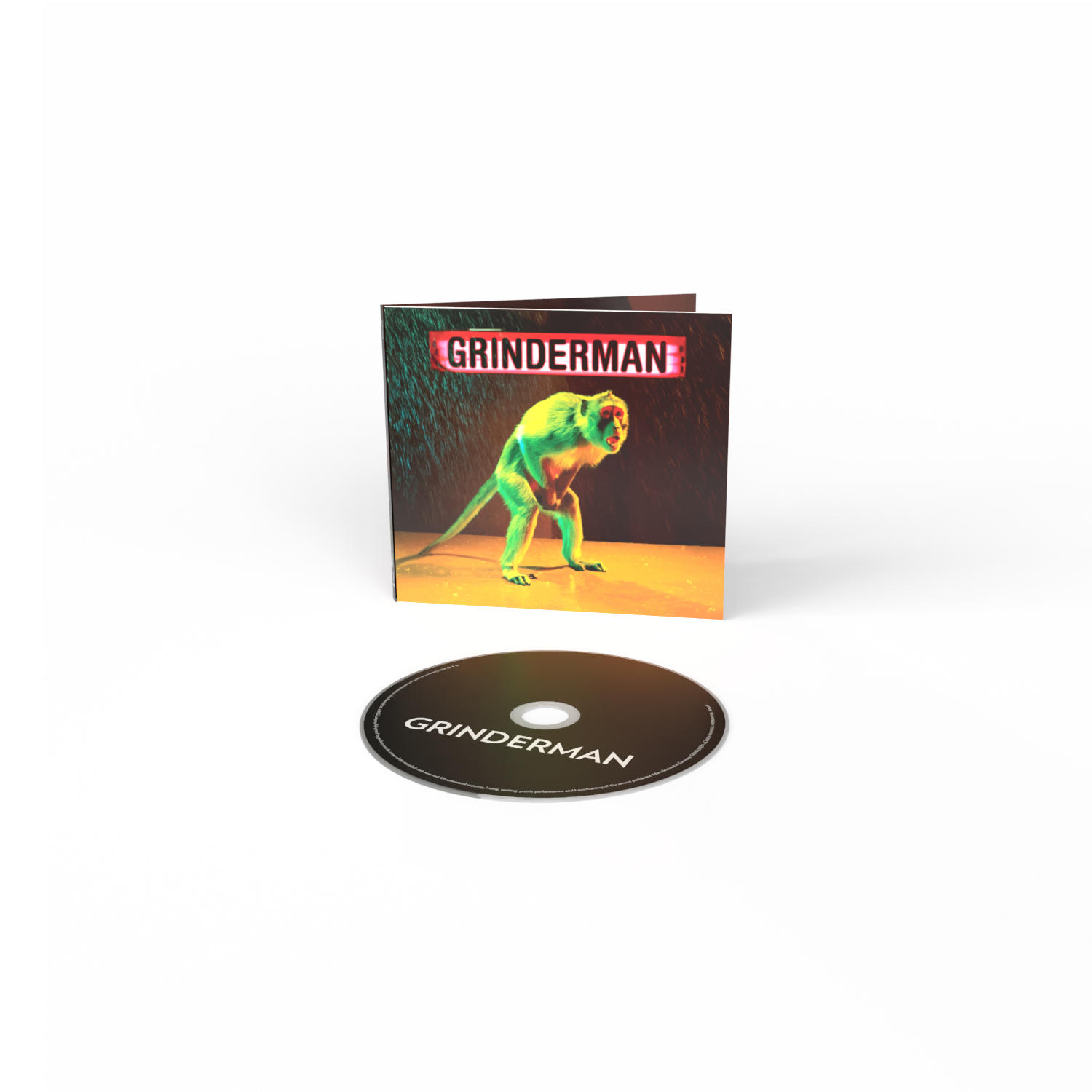 CD-Album in einem Case, grüner Affe im Regen, Grinderman-Logo und eine schwarze CD, weißer Hintergrund.