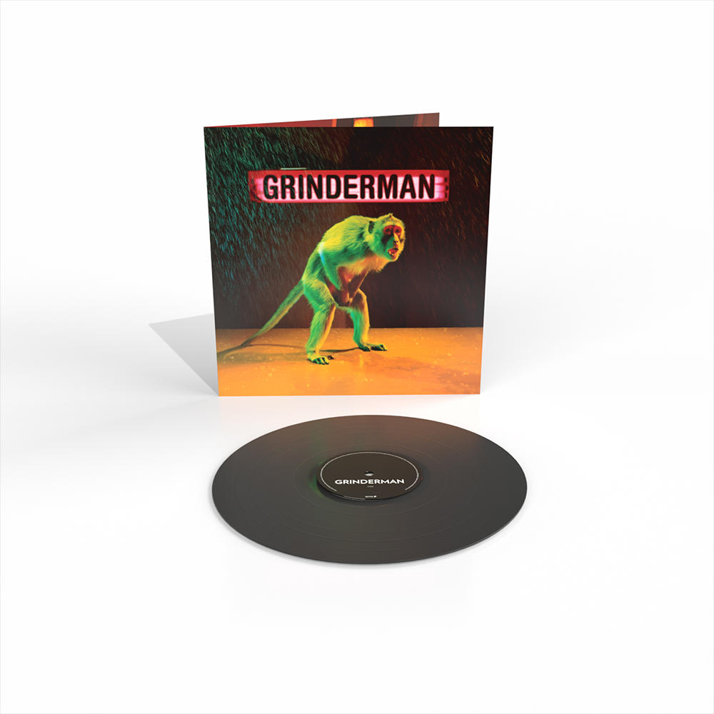 Albumcover mit einem grünen Affen im Regen, Grinderman-Schild oben und einer schwarzen Vinylplatte.