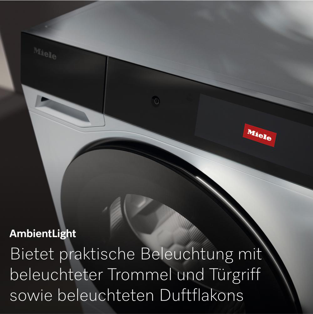 Eine Waschmaschine. Text sagt: Bietet praktische Beleuchtung mit beleuchteter Trommel und Griff sowie Duft.