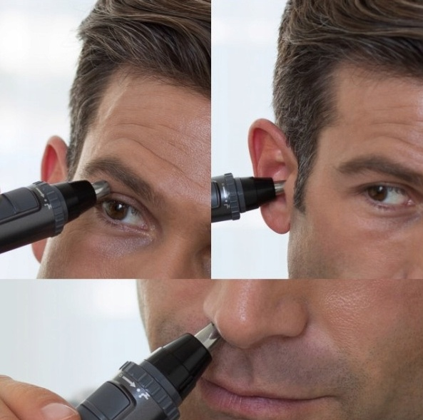 Mężczyzna przycina nos, ucho i brwi urządzeniem do pielęgnacji w zbliżeniach.