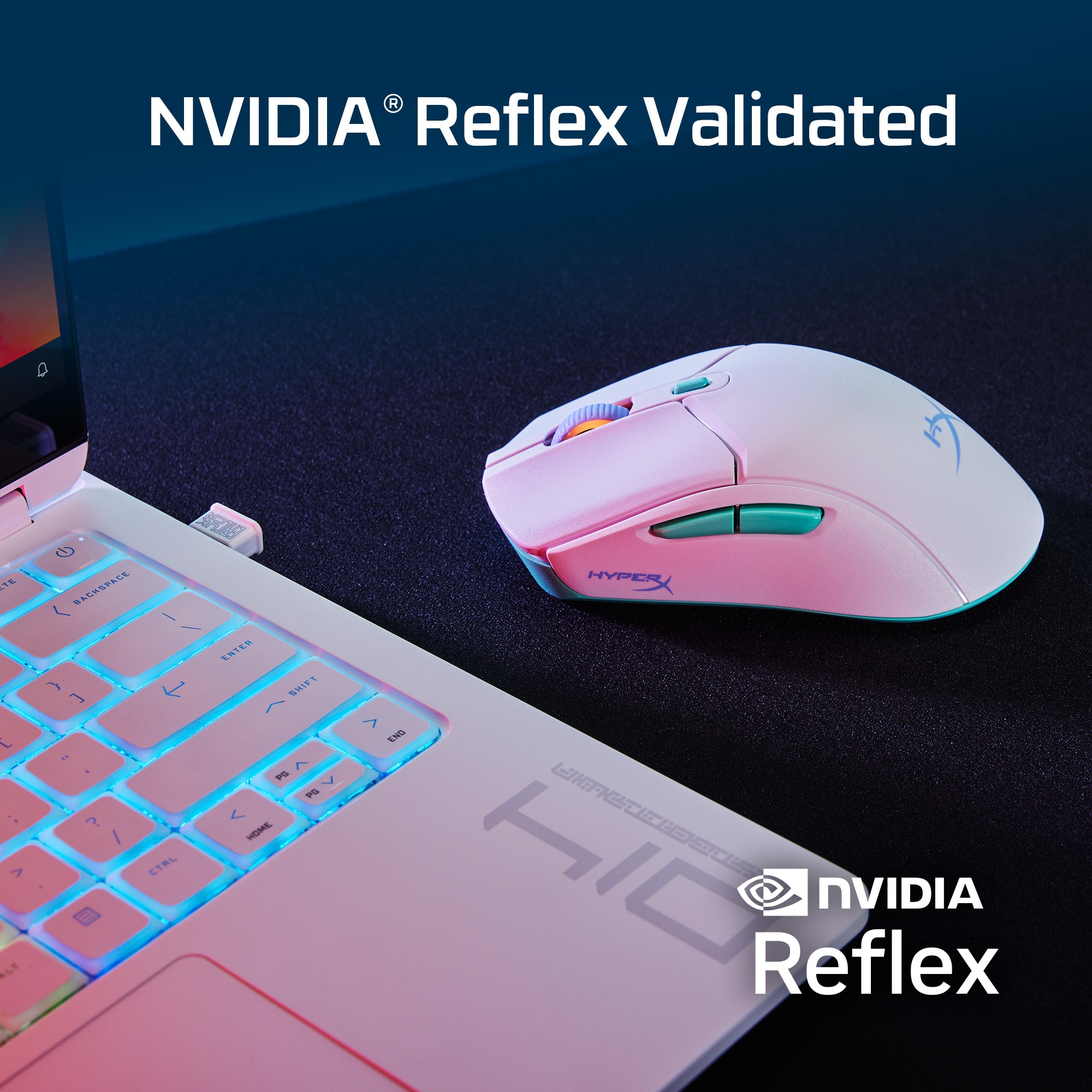 A pink and white gaming mouse next to a white laptop.