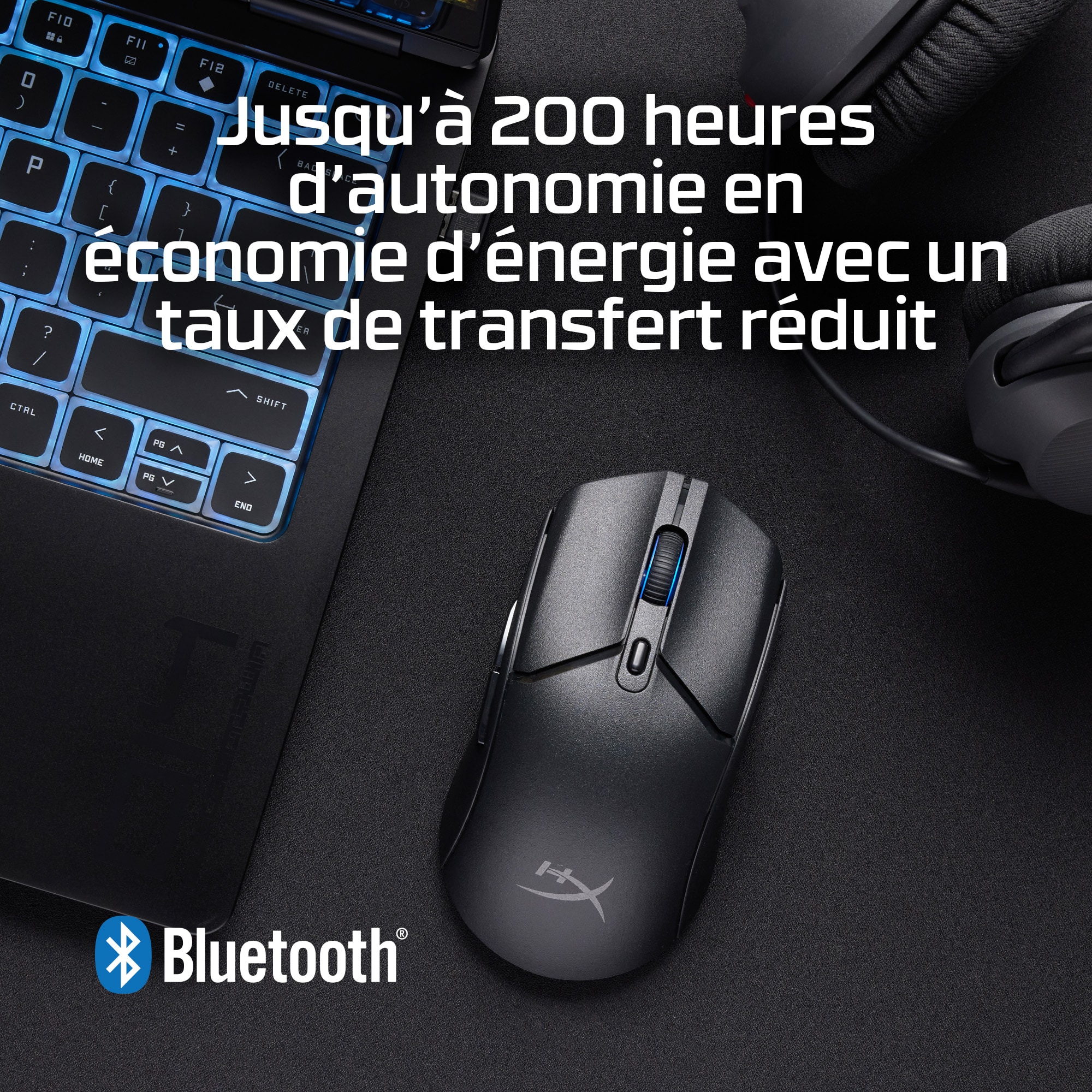 Black mouse on a table with a laptop and text about battery life.