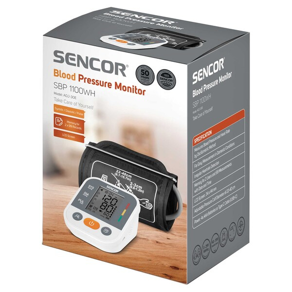 Pudełko monitora ciśnienia krwi z wyświetlaczem monitora i mankietu.