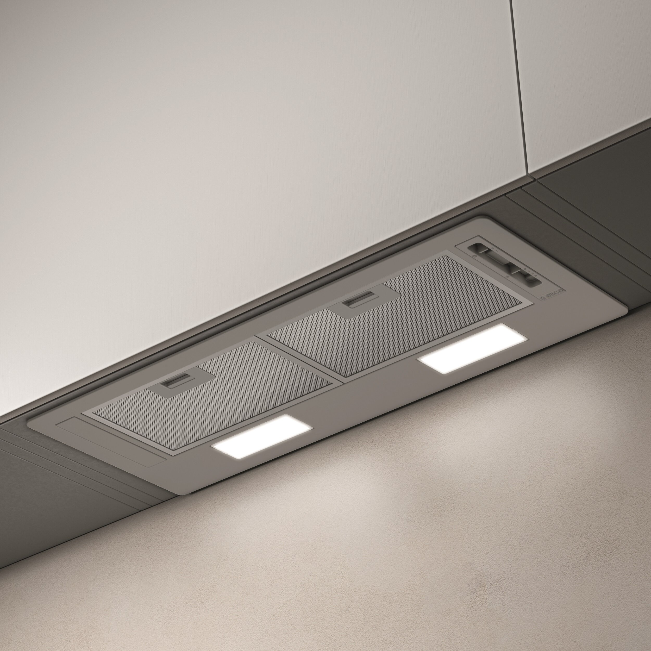 Okap kuchenny. Jest srebrny z dwoma światłami i dwoma obszarami wentylacji.