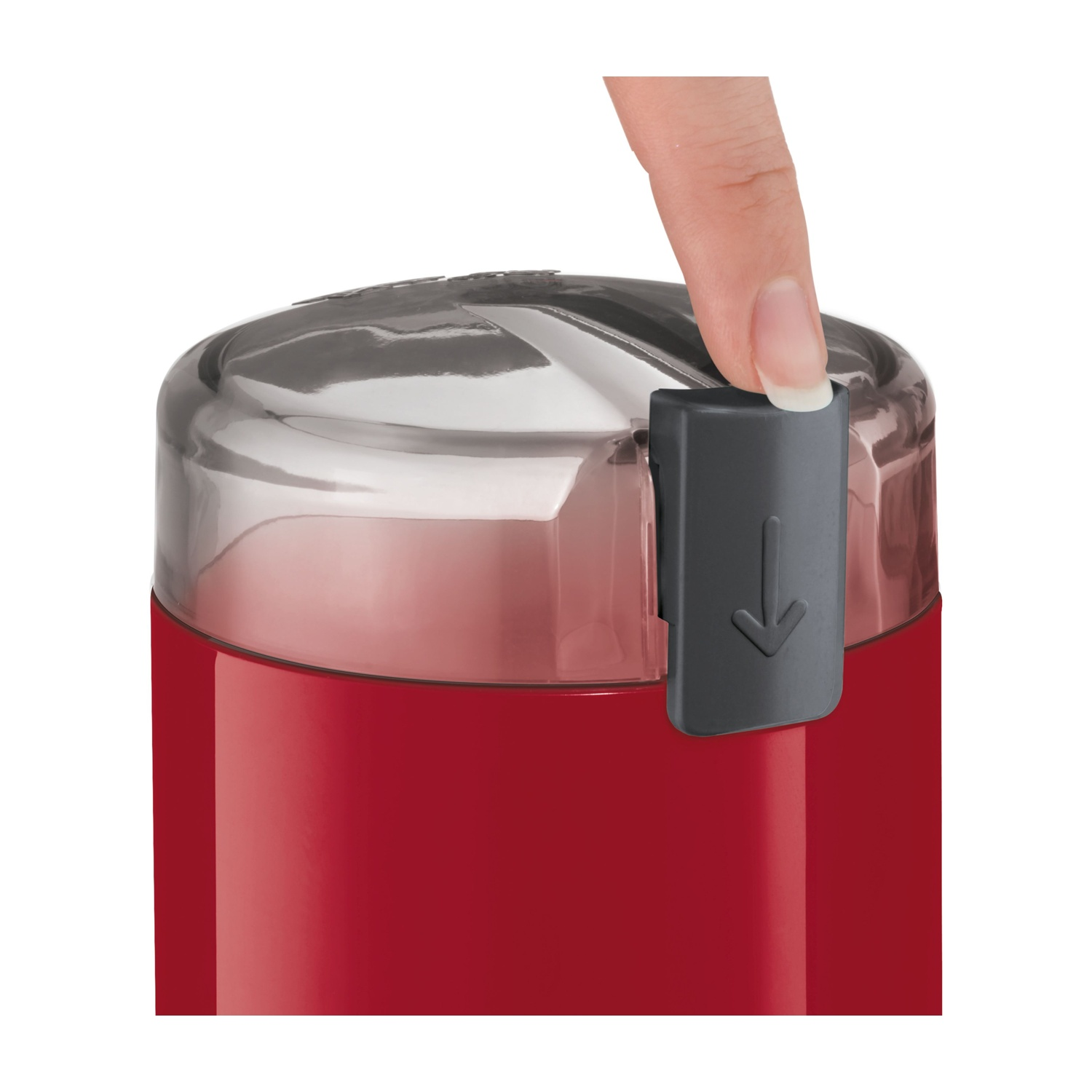 Un dito preme un pulsante su un macinacaffè rosso, vista ravvicinata.